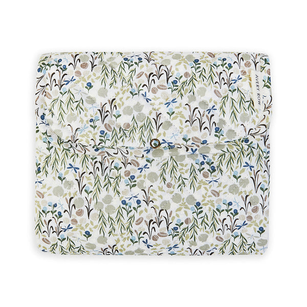 A fold up baby changing mat in a floral print by Avery Row
