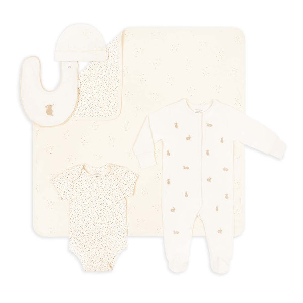A starter gift set for a baby, including sleepsuit, vest, hat, bib and blanket in signature Avery Row prints