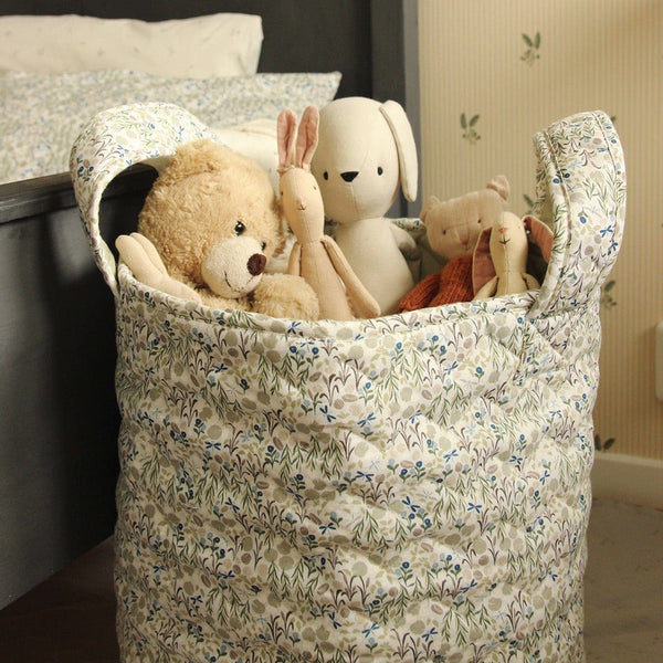 A large quited toy storage basket in riverbank floral print by Avery Row
