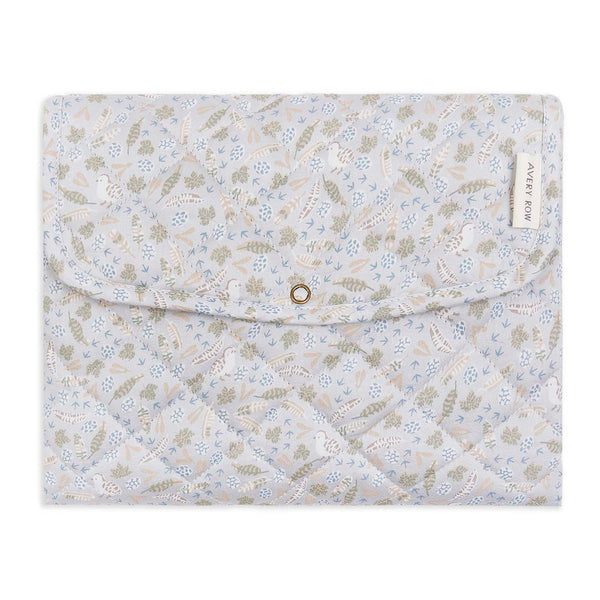 A fold up baby changing mat by Avery Row in a neutral nature print