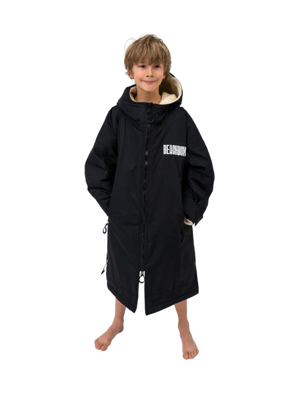 A kids waterproof changing robe with sherpa lining and zip front.