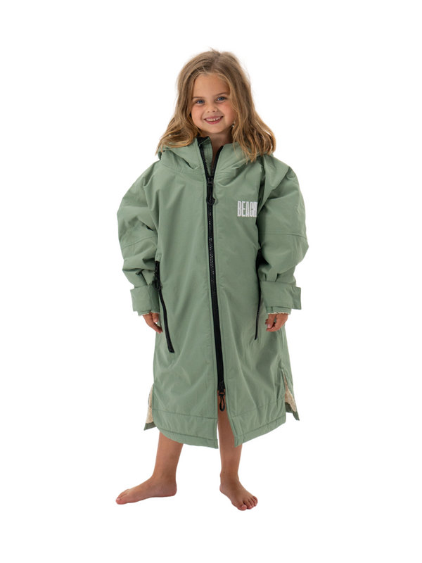 Kids waterproof changing robe in mint green with sherpa lining and chunky zip at the front.