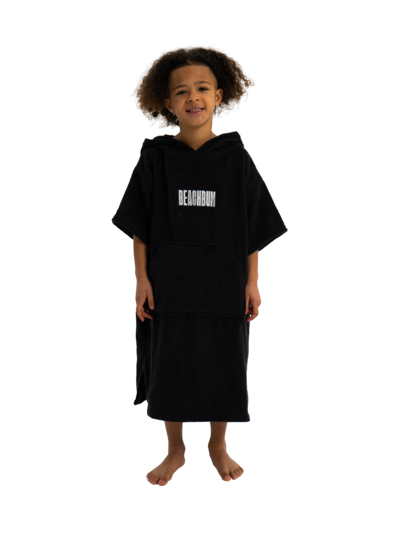 Kids towelling poncho in black with white beachbum logo.