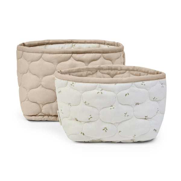 A set of 2 quilted strorage baskets by Avery Row, in a pretty leaf print and reversible solid colour