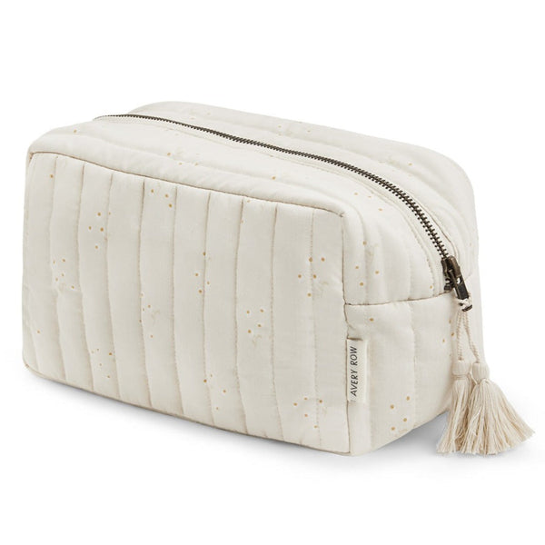 Quilted wash bag in chamomile print by Avery Row with a zip top and tassle
