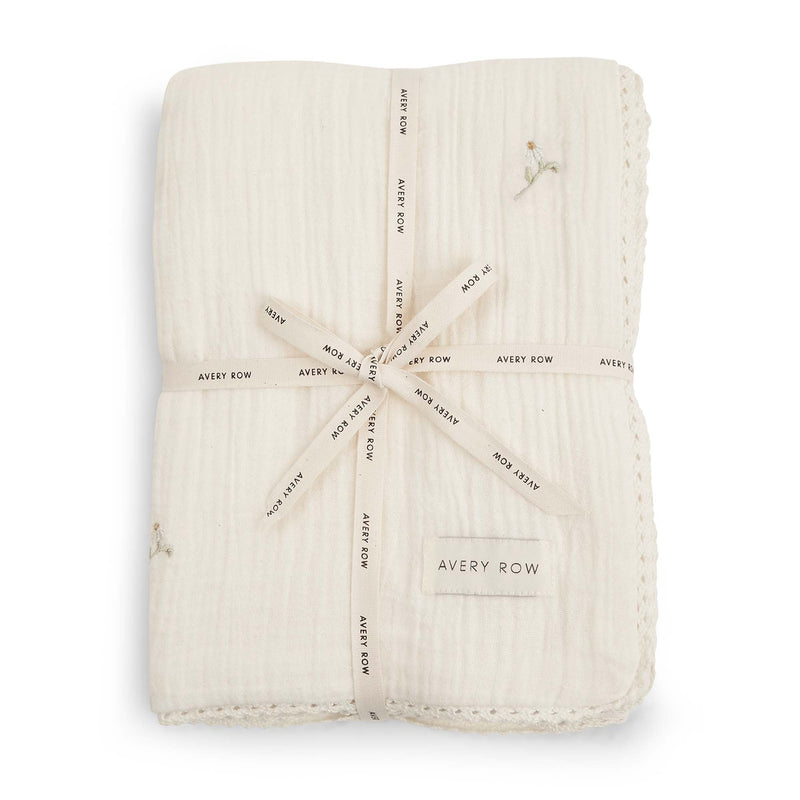 Embroidered muslin baby blanket with lace trim