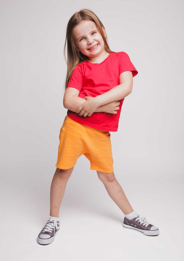 Organic cotton kids shorts available in 4 colours - red, orange, blue, green